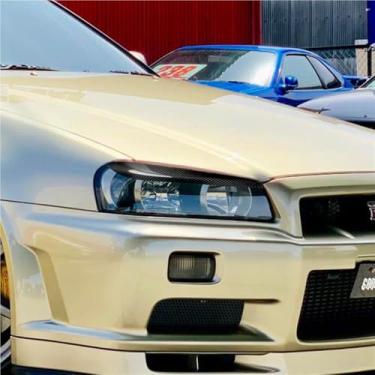 Imagem de 2 peças de decoração para sobrancelha de farol dianteiro esquerdo e direito em fibra de carbono real para carro, cor preta, compatível com Nissan Skyline R34 GTR GT-T 1999-2002