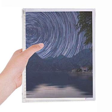 Imagem de Caderno de folhas soltas com estrelas do ano de luz, céu noturno escuro, diário recarregável, papelaria