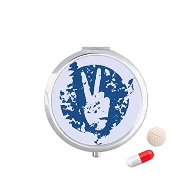 Imagem de Caixa de comprimidos com desenho de vitória com símbolo azul, caixa de armazenamento de medicamentos