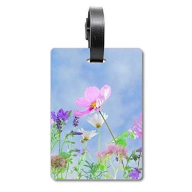 Imagem de Bolsa de mala com fundo azul roxa e rosa com etiqueta para cartão de bagagem