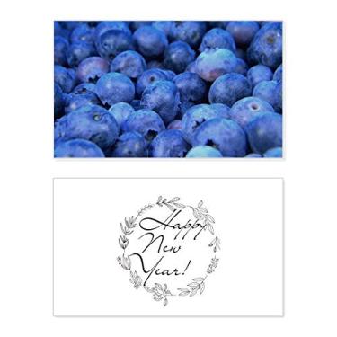Imagem de Foto de frutas tropicais de mirtilo fresco, ano novo, cartão de felicitações, mensagem de abençoamento presente