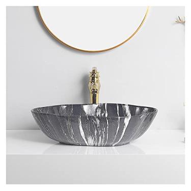 Imagem de Lavatório de cerâmica para pia de banheiro com textura de mármore arte oval acima do balcão lavatório com torneira dourada e pia de vaso de drenagem