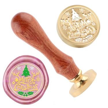 Imagem de Carimbo de lacre de cera de Natal Feliz Natal e uma cabeça de carimbos de cabo de madeira para decoração de presente, cartões de Natal, envelopes de ano novo, lacre de cera