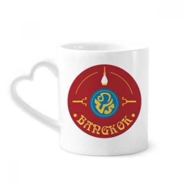 Imagem de Caneca com escudo de personagem especial da cultura da Tailândia, copo de coração de vidro de cerâmica