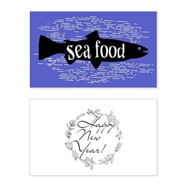 Imagem de Cartão de felicitações de ano novo com desenho de peixe de animal preto, mensagem de abençoe presente