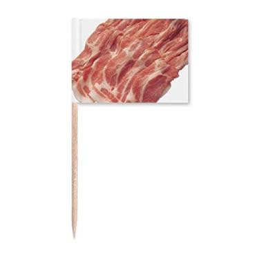 Imagem de Rolo de carne crua com textura de palito de dentes marcadores para decoração de festa