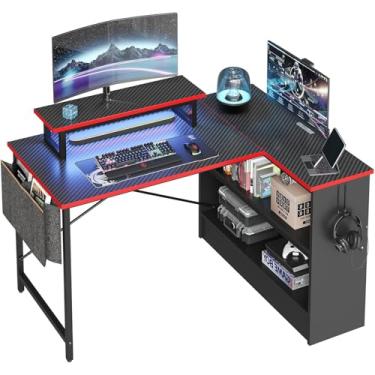 Imagem de Bestier Mesa de jogos em forma de L com prateleiras de armazenamento, mesa de computador reversível de 106 cm com luzes LED, mesa de jogos de PC com bolsa de armazenamento lateral e suporte de monitor