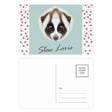 Imagem de Cartão postal de aniversário Loris de Natal com flor de Natal e olhos grandes, cartão postal de bênção