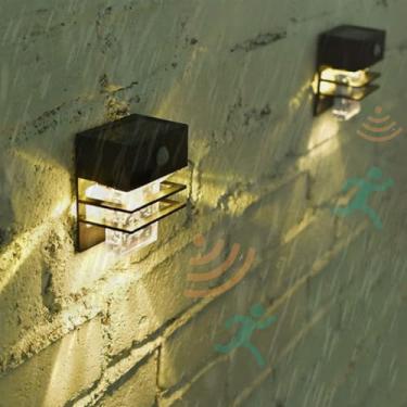 Imagem de LED Apliques solares de parede exterior com detetor de movimento candeeiros de parede IP65 impermeável jardim exterior iluminação para Pathway terraço varanda escada (luz quente preta, 2 peças)