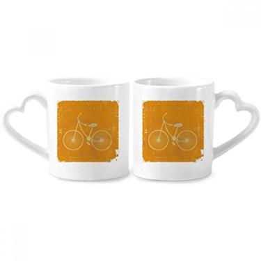 Imagem de Conjunto de canecas de porcelana para casal, estampa amarela, com ilustração esportiva de bicicleta, coração
