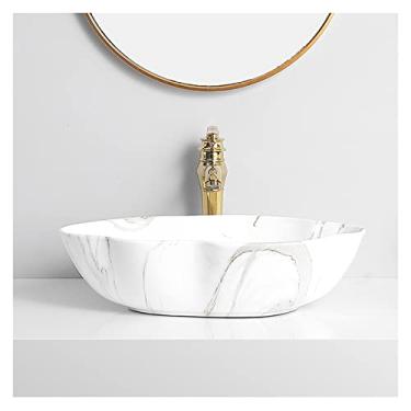 Imagem de Lavatório de cerâmica para pia de banheiro com textura de mármore arte oval acima do balcão lavatório com torneira dourada e pia de vaso de drenagem