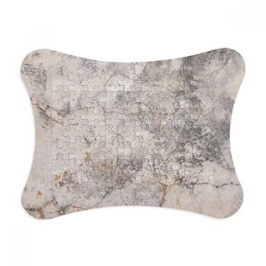 Imagem de Moldura de parede de pedra com textura rachada e enfeite de quebra-cabeça