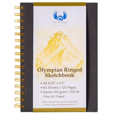 Imagem de Caderno de desenho com anéis olímpicos, tamanho A5 14 x 21 cm, encadernação de anel de metal dourado fica plano, 60 folhas/120 páginas, papel de arte 150 GSM para artistas, ideal para lápis, tinta