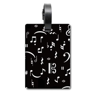 Imagem de Barra de música branca e notas, bolsa de mala preta, etiqueta para cartão de bagagem