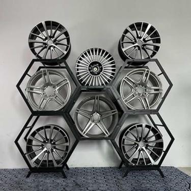 Imagem de Exibição de rack de pneu resistente, organizador de pneus de aço empilhável para garagem e loja, prateleiras de armazenamento multicarro, 5 quadros + 2 bases, suporte de cubo de pneu durável