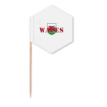 Imagem de Bandeira de galesa com emblema território, palitos de cupcake, festa comemoração