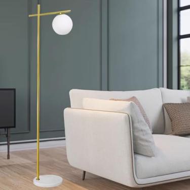 Imagem de Luminária de chão minimalista para interiores, com esfera de vidro branco, ideal para leitura em cantos. Perfeita para sala de estar, com interruptor de pé, base de mármore e design que prot