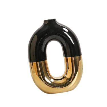 Imagem de Ioensy Vaso em formato de donut, dourado e preto, em cerâmica vazada, estilo moderno e minimalista, ideal para mesa de lareira.