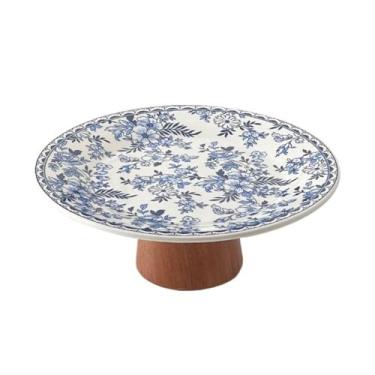 Imagem de Fruteira Fruteira decorativa de cerâmica com pedestal floral e base de madeira para servir aperitivos. Decoração de mesa