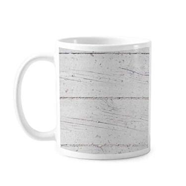 Imagem de Caneca de cerâmica cerâmica com textura de papel de parede áspero para chão de madeira branca