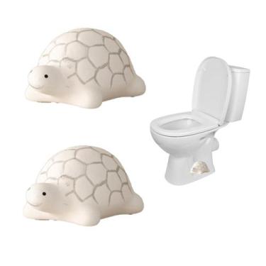 Imagem de 2 capas decorativas de cerâmica em formato de tartaruga para parafusos