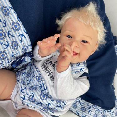 Imagem de Bebê Reborn Menino Realista Loira Fio a Fio Olhos Azuis Corpo de Pano 