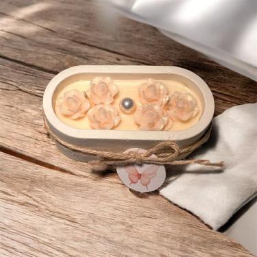 Imagem de Vela Decorativa com Flores, Suporte em Concreto e Gesso, Design Artesanal com Laço Rústico