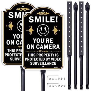Imagem de Placa de segurança "SMILE! YOU'RE ON CAMERA" Pacote com 2 (32 × 8 polegadas) com suportes de 89 cm - Aviso de vigilância divertido para casa e negócios