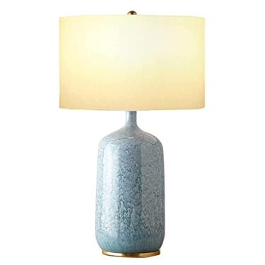 Imagem de Abajur de mesa em cerâmica azul-marinho, estilo americano, com cúpula em formato de tambor, inspirado na Idade Média. Ideal para cabeceira, mesa de cabeceira ou sala de estar.