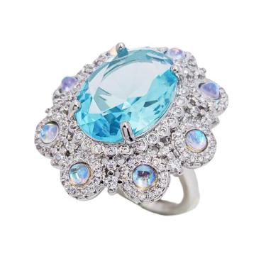 Imagem de CYPINA Anel de topázio azul de corte oval prateado de luxo com design de aglomerado de pedra da lua e zircônia cúbica, joia de coquetel