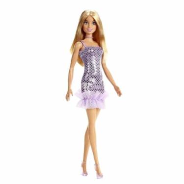 Imagem de Barbie em um vestido roxo de bolinhas