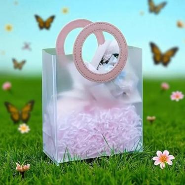 Imagem de Uma sacola transparente de PVC com alças redondas de couro, medindo 18x16x8 cm. (sacola presente)(BRANCA)