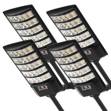 Imagem de JOISTOON Luzes de rua solares de 4 peças à prova d'água, luzes LED 6500K com sensor de movimento, holofotes solares com iluminação comercial do crepúsculo ao amanhecer remoto para caminho de quintal