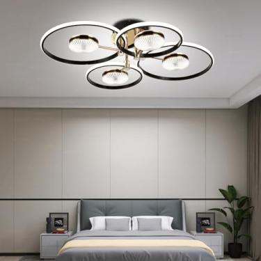 Imagem de Luminária de teto LED moderna para sala de estar com design circular criativo, dimerizável de 3000k a 6500k, com controle remoto, em acrílico preto (4 anéis, 72W).