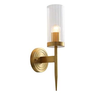 Imagem de Luminária de parede moderna cilíndrica com cúpula de vidro transparente, ideal para iluminação ambiente em salas de estar e quartos.