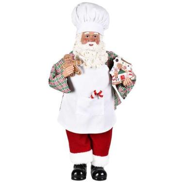 Imagem de Papai Noel confeiteiro em pé com avental, toque blanche de chef de coz