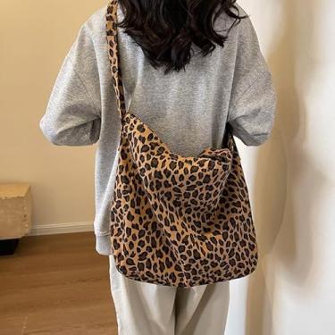 Imagem de Bolsa de ombro de leopardo macia com alça larga, interior espaçoso para carteira de laptop cosméticos, bolsa de mão grande leve para viagens de compras e passeios casuais