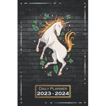 Imagem de Daily Planner 2023-2024: 6x9 inches, Softcover | From Sunday to Saturday | One Week on a Double Page | with Monthly Overview | Unicorn Horse Ride | qx1