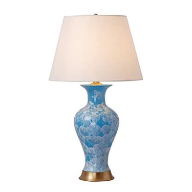 Imagem de Abajur de mesa moderno em cerâmica azul com cúpula de tecido, estilo oriental, com design tradicional e detalhes em cristal.