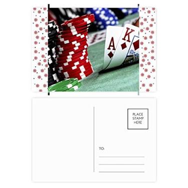 Imagem de Poker espalhado com fichas de fotos de Natal, flor de Natal, cartão postal de celebração