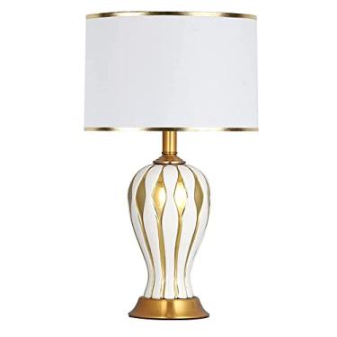 Imagem de Abajures de mesa de cerâmica com cúpula cilíndrica de tecido branco, ideais para sala de estar, quarto, mesa de cabeceira ou escritório.